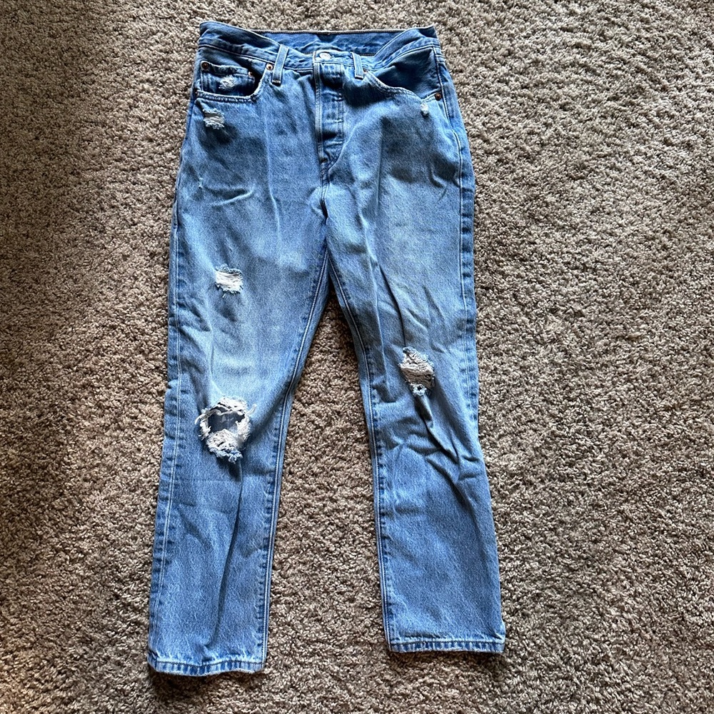 Levi’s 501 blue jeans with rips